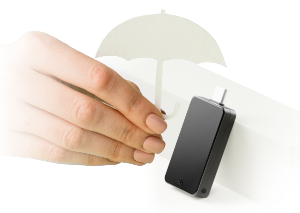 Hand holding a BitBox device under a small umbrella, symbolizing insurance